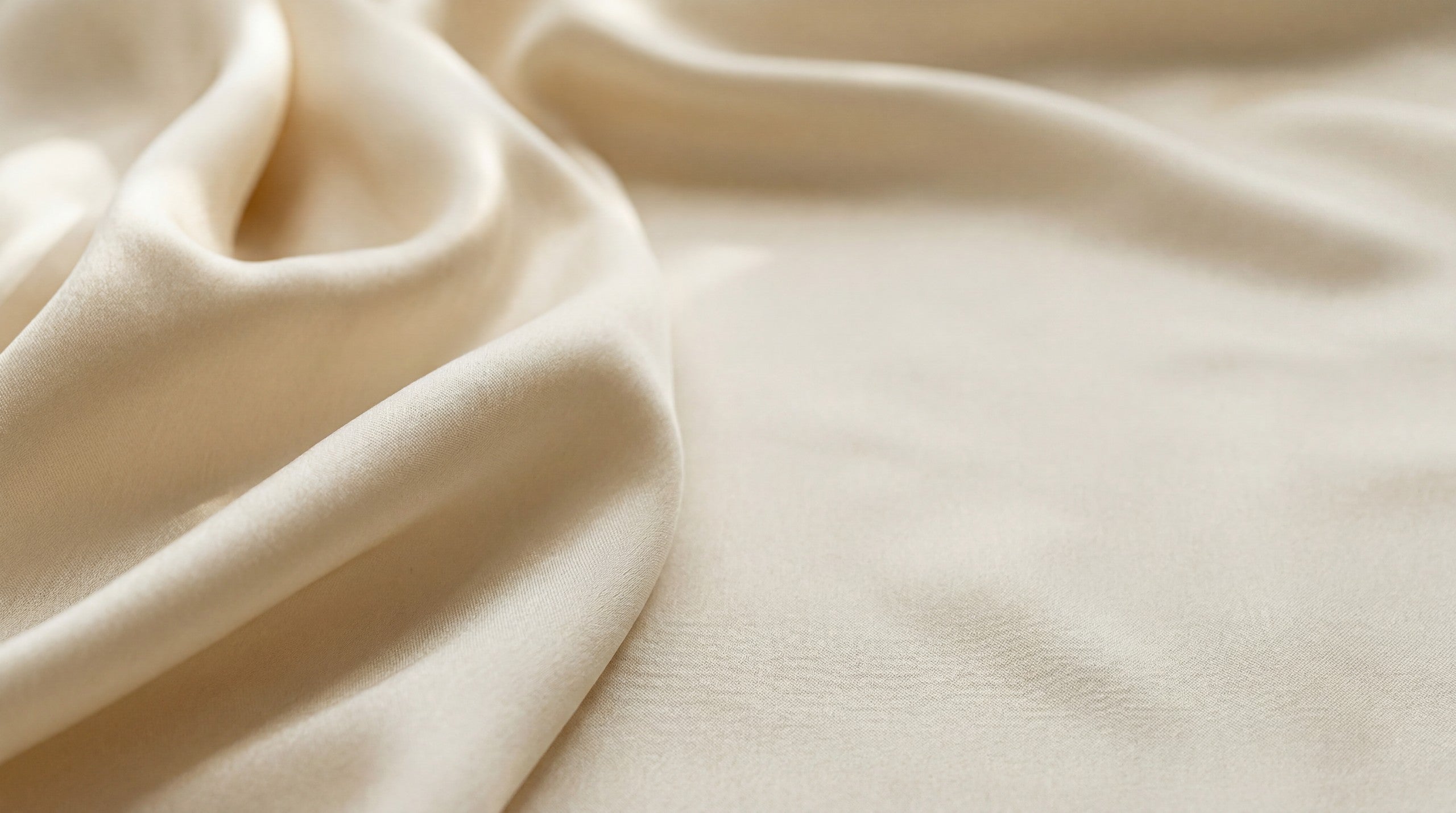 Warm ivory mulberry silk with soft luminous folds and fine weave